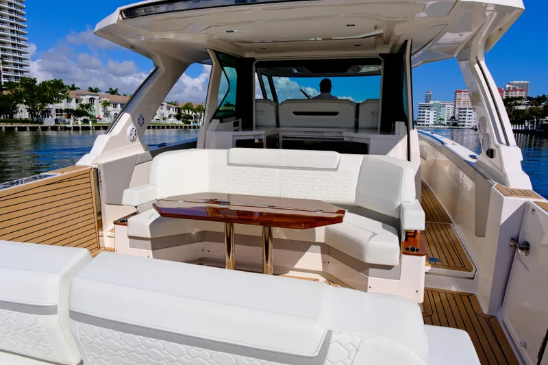 Slide: The Image of 2023 Tiara Yachts 48 LS luxury yacht interior with elegant seating and wooden table. - 22