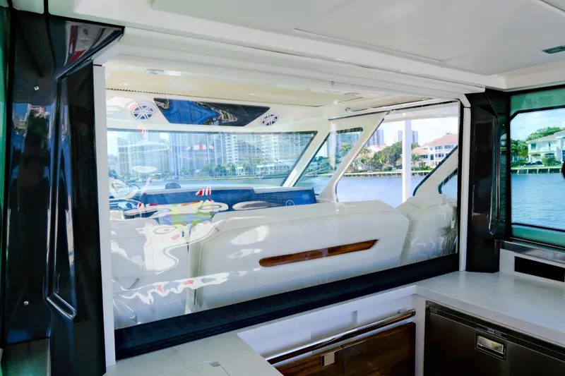 Slide: The Image of 2023 Tiara Yachts 48 LS interior with luxurious seating and waterfront view. - 29
