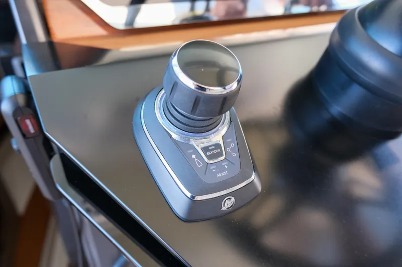 Slide: The Image of Joystick control on 2023 Tiara Yachts 48 LS dashboard. - 34