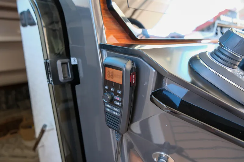 Slide: The Image of 2023 Tiara Yachts 48 LS yacht dashboard with mounted communication device. - 35