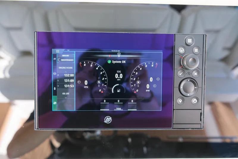 Slide: The Image of Dashboard display of 2023 Tiara Yachts 48 LS showing system status and engine hours. - 37