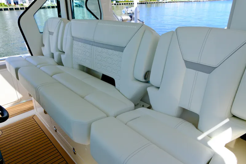 Slide: The Image of Luxurious seating on 2023 Tiara Yachts 48 LS, featuring elegant white upholstery. - 38
