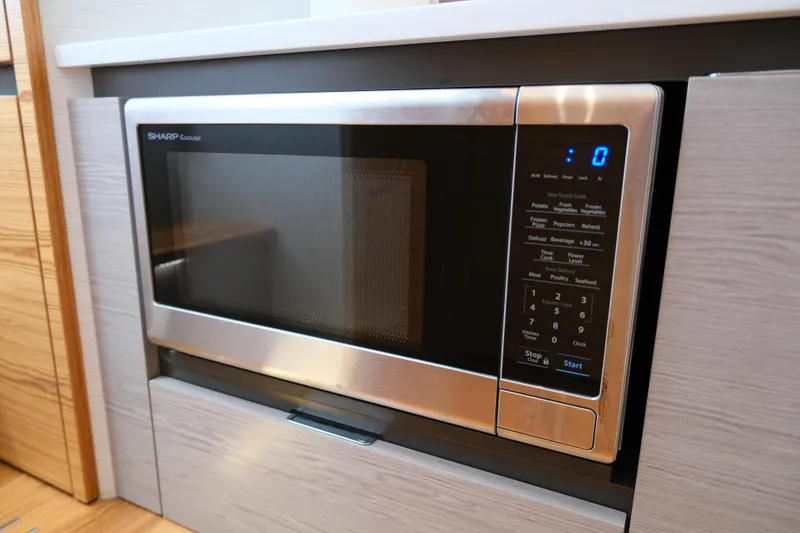 Slide: The Image of Modern microwave oven in 2023 Tiara Yachts 48 LS kitchen area. - 44