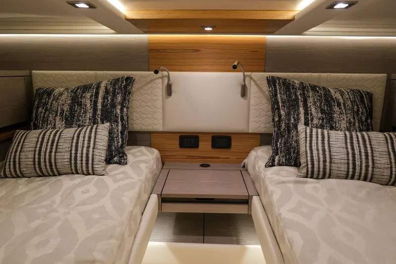 Slide: The Image of Luxurious 2023 Tiara Yachts 48 LS cabin with twin beds and elegant decor. - 46