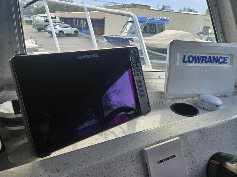 Slide: The Image of Lowrance navigation system on 2020 North River 2500s boat dashboard. - 15