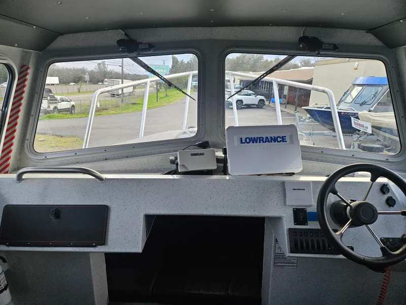 Slide: The Image of Interior view of 2020 North River 2500s boat with Lowrance navigation system. - 18