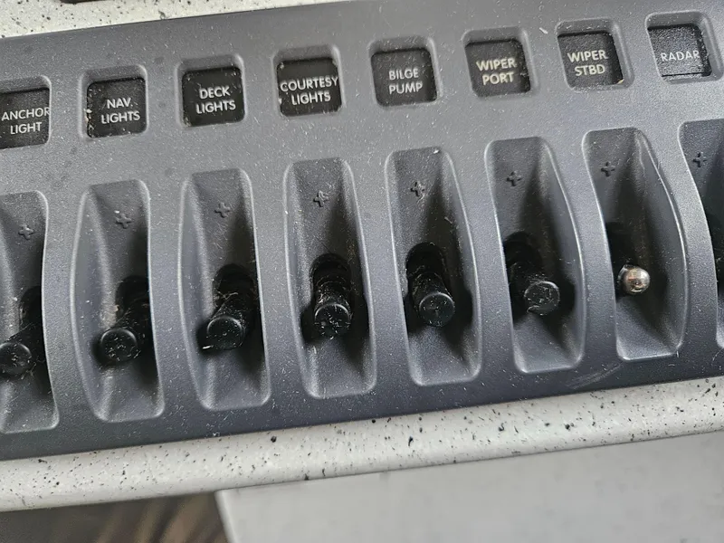 Slide: The Image of Control panel of a 2020 North River 2500s boat with labeled switches. - 19