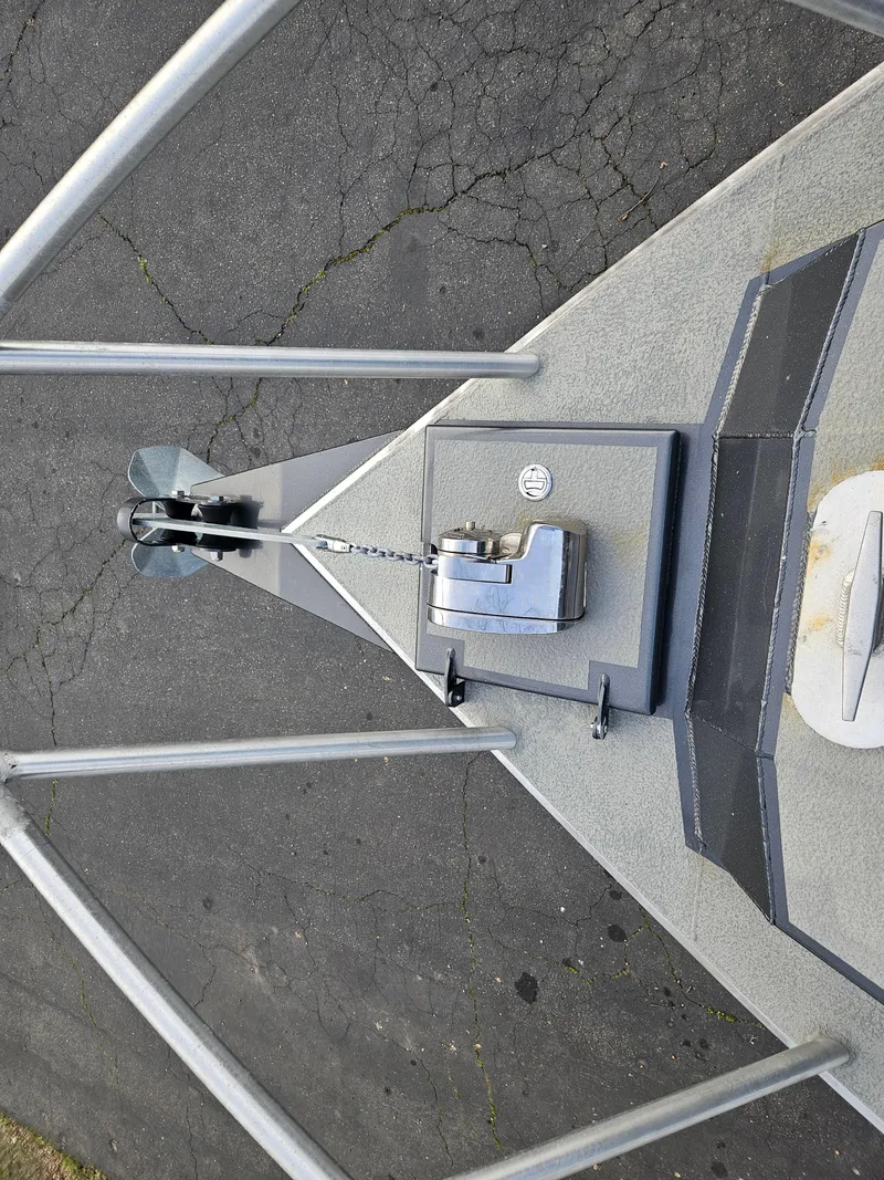 Slide: The Image of 2020 North River 2500s boat anchor system on a cracked pavement background. - 24