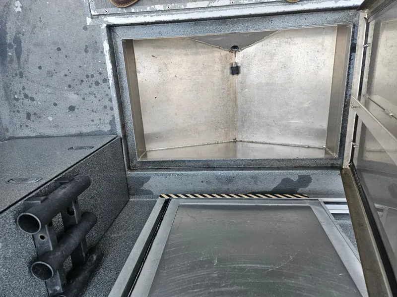 Slide: The Image of Interior view of a 2020 North River 2500s boat compartment with storage space. - 25