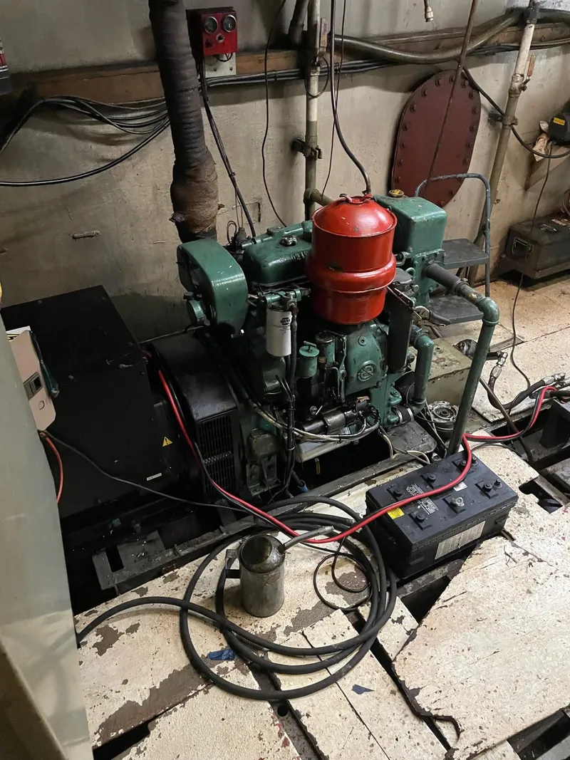 Slide: The Image of Engine room of a 1983 Commercial Freezer Trawler, showcasing machinery and components. - 11