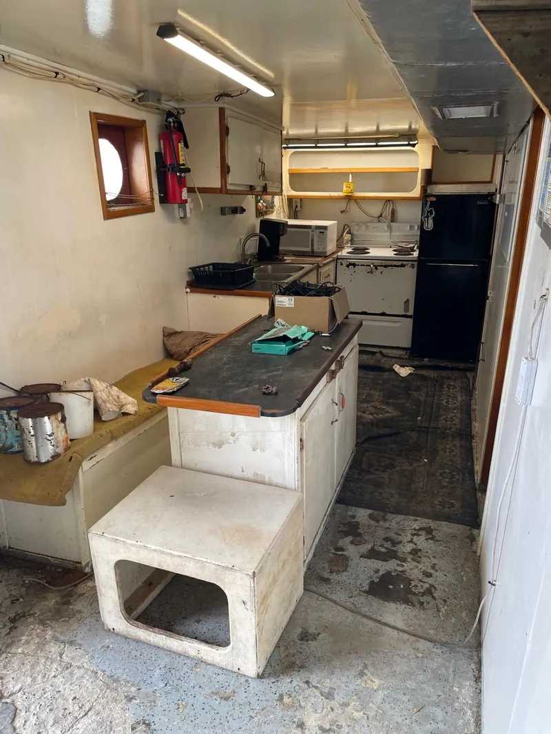 Slide: The Image of Interior of a 1983 commercial freezer trawler with equipment and control panels. - 16
