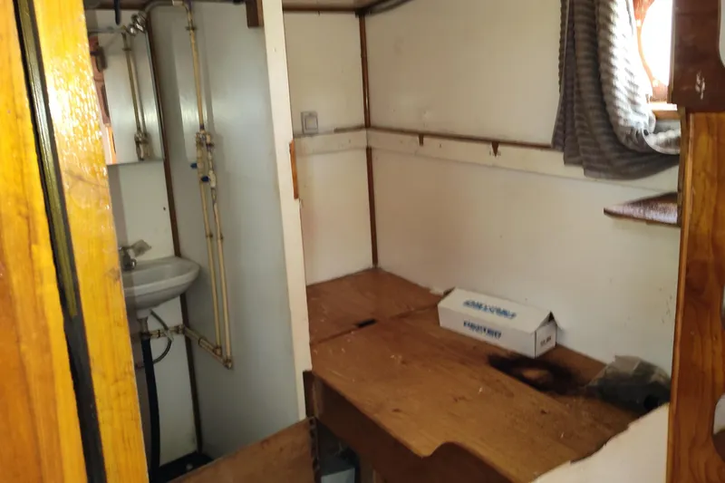 Slide: The Image of Interior of a 1983 commercial freezer trawler with kitchen and storage area. - 17