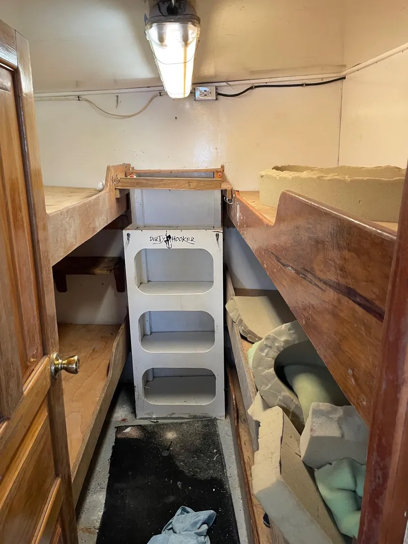 Slide: The Image of Interior of a 1983 commercial freezer trawler with bunk beds and storage shelves. - 19