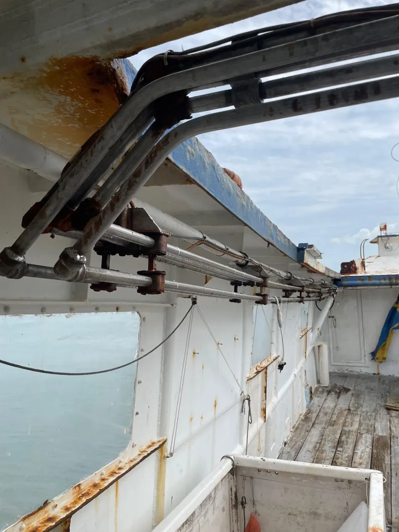 Slide: The Image of Interior of a 1983 commercial freezer trawler with wooden bunks and storage shelves. - 20