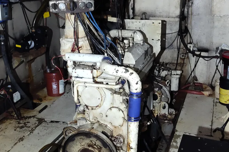 Slide: The Image of Engine room of a 1983 commercial freezer trawler, showcasing machinery and piping. - 4