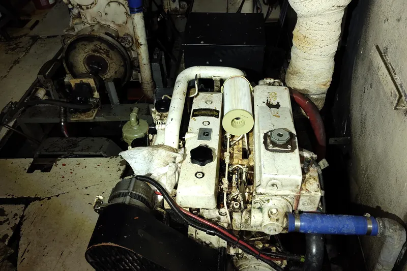 Slide: The Image of Engine room of a 1983 Commercial Freezer Trawler, showcasing machinery and wiring. - 5