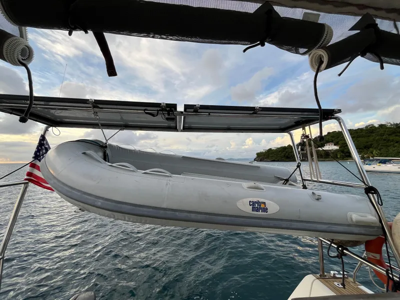 Slide: The Image of Inflatable dinghy on Beneteau Oceanis 58 sailboat, 2011 model, with scenic ocean backdrop. - 11