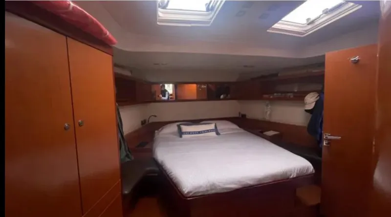 Slide: The Image of Luxurious cabin interior of 2011 Beneteau Oceanis 58 yacht with skylights and wooden furnishings. - 4
