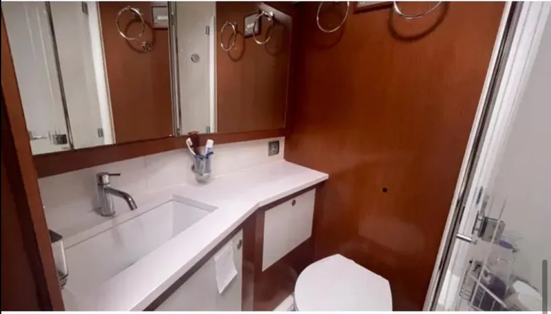 Slide: The Image of Luxurious bathroom in 2011 Beneteau Oceanis 58 yacht with modern fixtures and wood accents. - 6