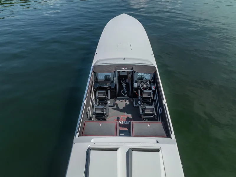 Slide: The Image of Cigarette 515 boat, 2023 model, aerial view on water, showcasing cockpit and seating. - 12