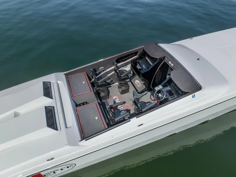 Slide: The Image of 2023 Cigarette 515 boat interior, aerial view, sleek design, luxury seating, on calm water. - 13
