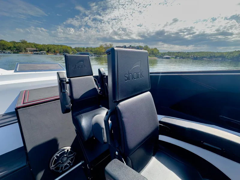 Slide: The Image of Luxury seating on 2023 Cigarette 515 boat with scenic lake view. - 17