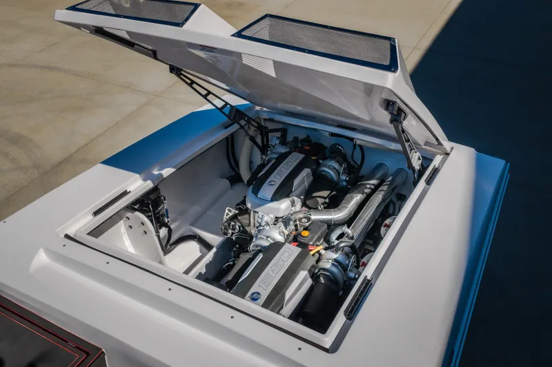 Slide: The Image of 2023 Cigarette 515 engine compartment with open hatch, showcasing powerful engine components. - 68