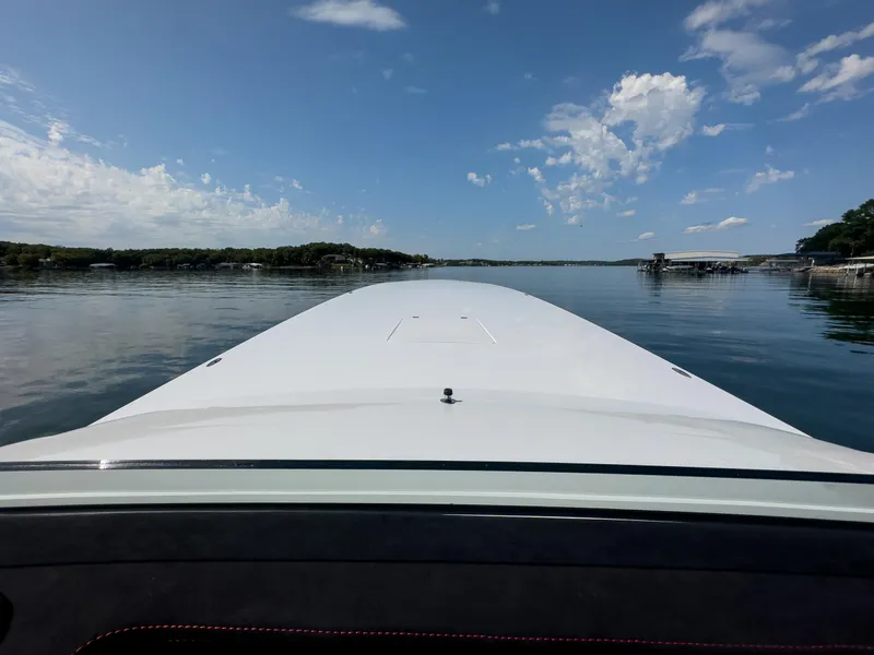 Slide: The Image of 2023 Cigarette 515 boat on calm water under a clear blue sky. - 18