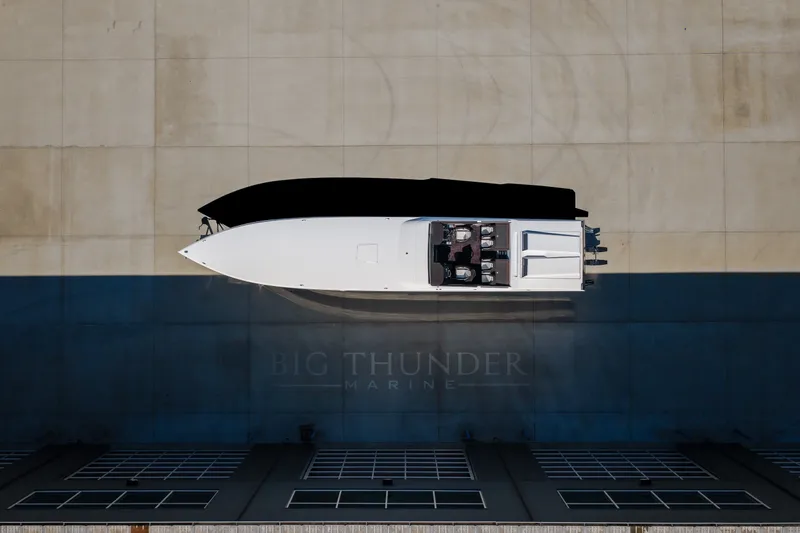 Slide: The Image of Aerial view of 2023 Cigarette 515 boat on concrete surface. - 19
