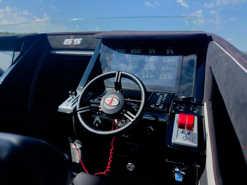 Slide: The Image of Cockpit of 2023 Cigarette 515 boat with advanced controls and digital display. - 23