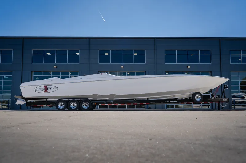 The Image of 2023 Cigarette 515 boat on trailer in front of modern building. - 3