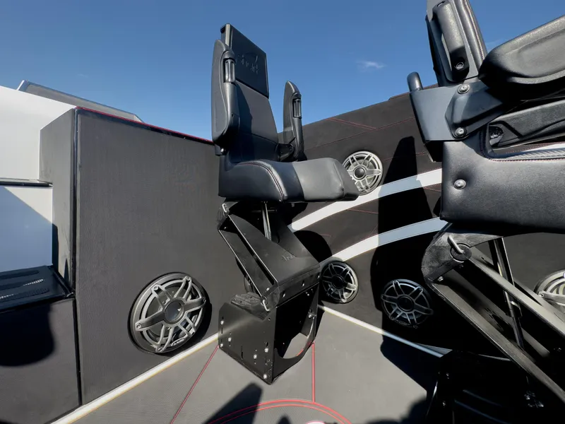 Slide: The Image of 2023 Cigarette 515 boat interior with black seats and speaker system. - 28