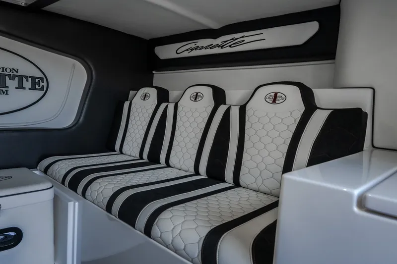 Slide: The Image of Luxurious interior seating of 2023 Cigarette 515 boat with stylish black and white design. - 77