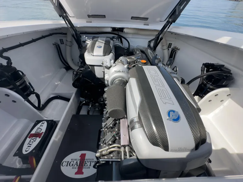 Slide: The Image of 2023 Cigarette 515 boat engine compartment with high-performance engines and open hatch. - 35