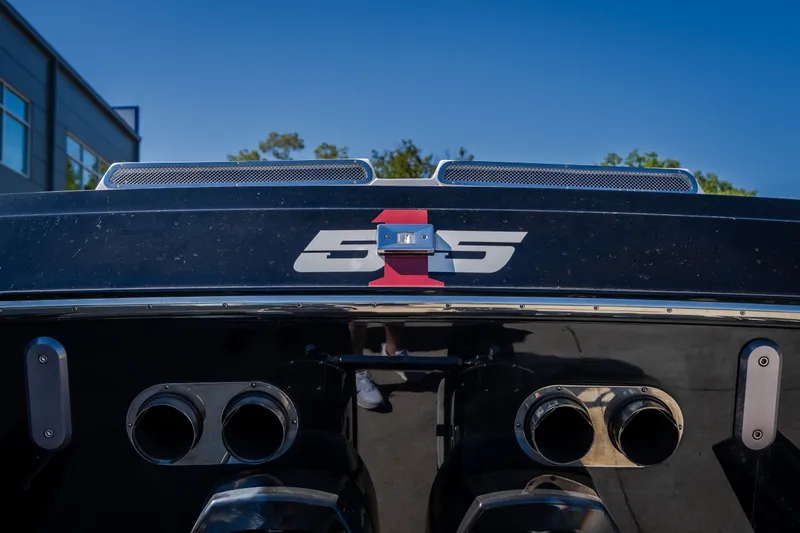 Slide: The Image of 2023 Cigarette 515 boat rear view with dual exhausts and logo. - 25