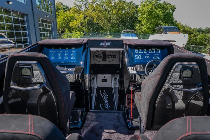 Slide: The Image of Cockpit of 2023 Cigarette 515 boat with advanced digital displays and luxurious seating. - 45