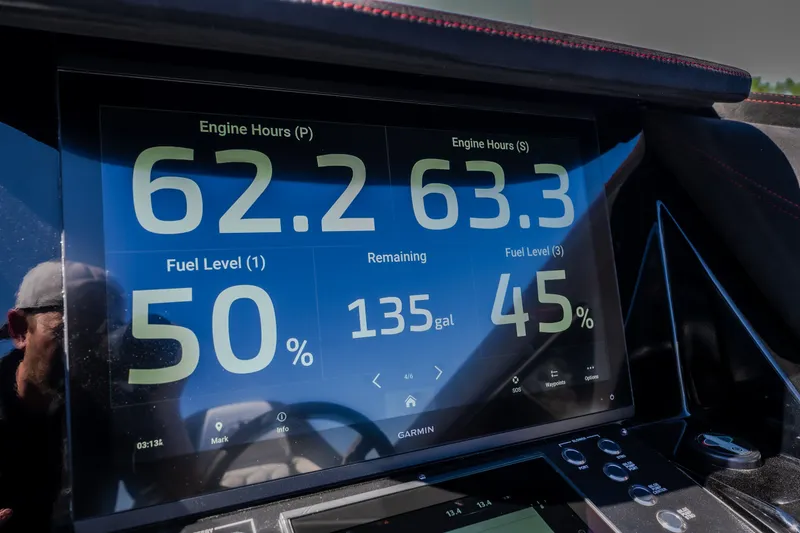 Slide: The Image of Dashboard display of a 2023 Cigarette 515 showing engine hours and fuel levels. - 53
