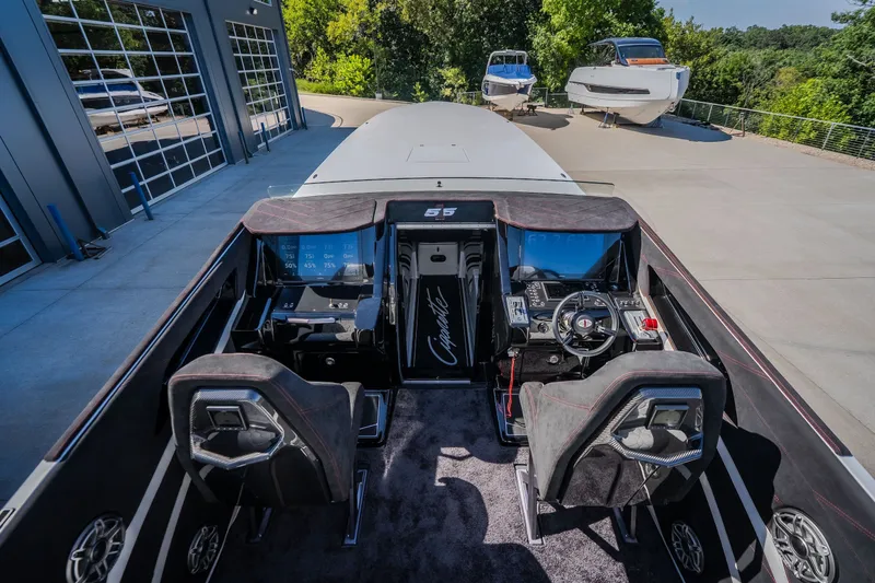 Slide: The Image of Interior view of 2023 Cigarette 515 boat cockpit with modern controls and seating. - 48