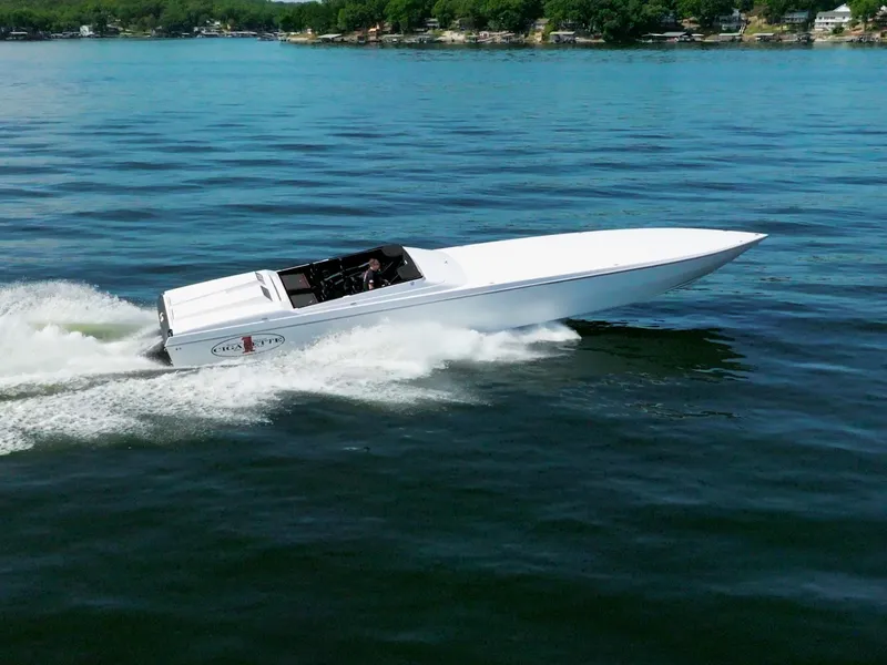 Slide: The Image of 2023 Cigarette 515 speedboat cruising on a calm lake. - 7