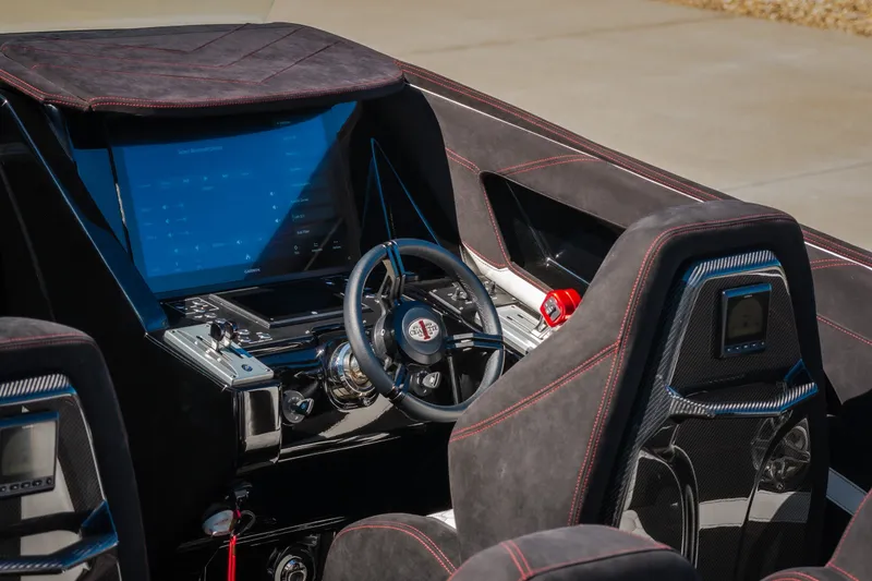 Slide: The Image of Interior of 2023 Cigarette 515 boat with modern dashboard and steering wheel. - 70