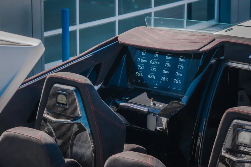 Slide: The Image of Interior of 2023 Cigarette 515 boat with advanced digital dashboard display. - 72