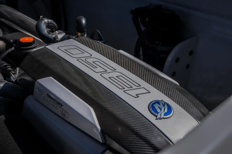 Slide: The Image of Close-up of a 2023 Cigarette 515 engine with Mercury Racing branding. - 44