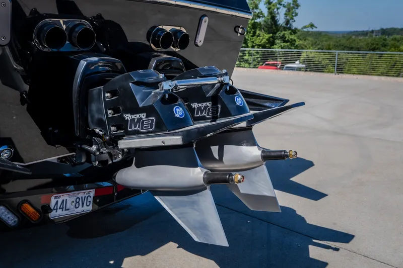 Slide: The Image of 2023 Cigarette 515 boat with dual Mercury Racing M8 drives, parked outdoors. - 23