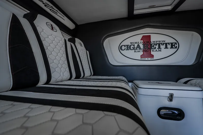 Slide: The Image of Interior of 2023 Cigarette 515 boat with luxury seating and racing team logo. - 50