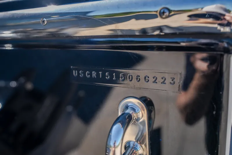 Slide: The Image of Close-up of a 2023 Cigarette 515 model with visible serial number. - 29