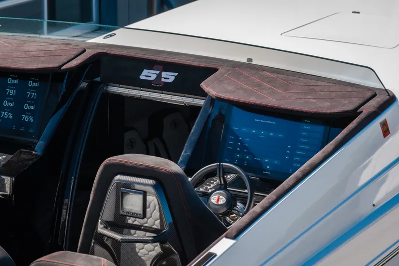 Slide: The Image of Interior of 2023 Cigarette 515 boat with advanced dashboard and steering wheel. - 71