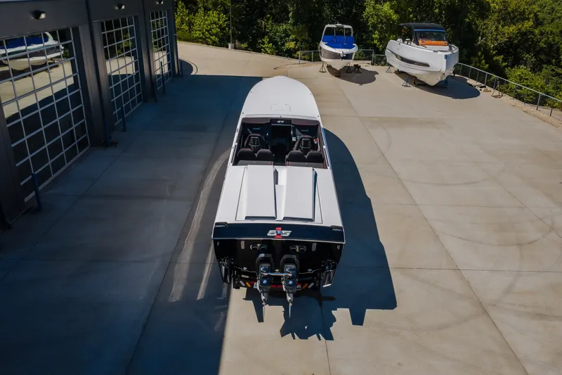Slide: The Image of 2023 Cigarette 515 boat parked outdoors with two other boats nearby. - 13