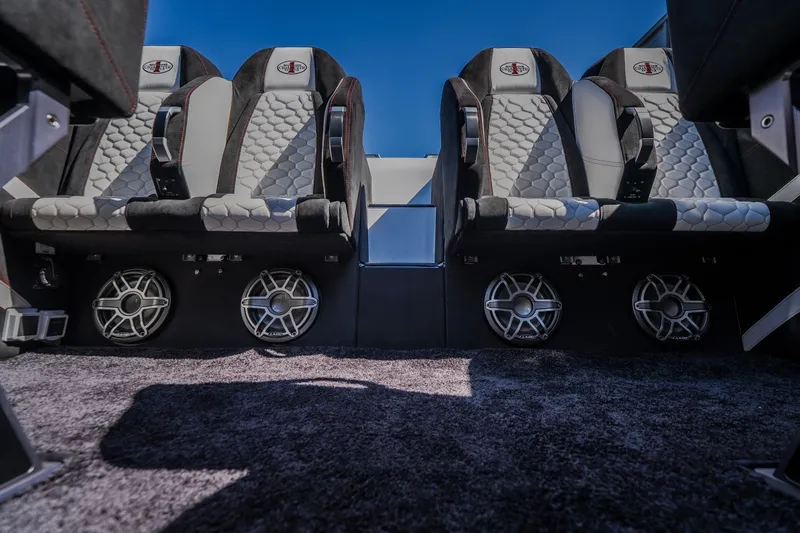 Slide: The Image of Luxurious seating and speakers in a 2023 Cigarette 515 boat interior. - 42