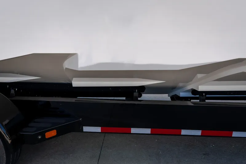 Slide: The Image of 2023 Cigarette 515 boat on trailer, showcasing sleek hull design. - 11