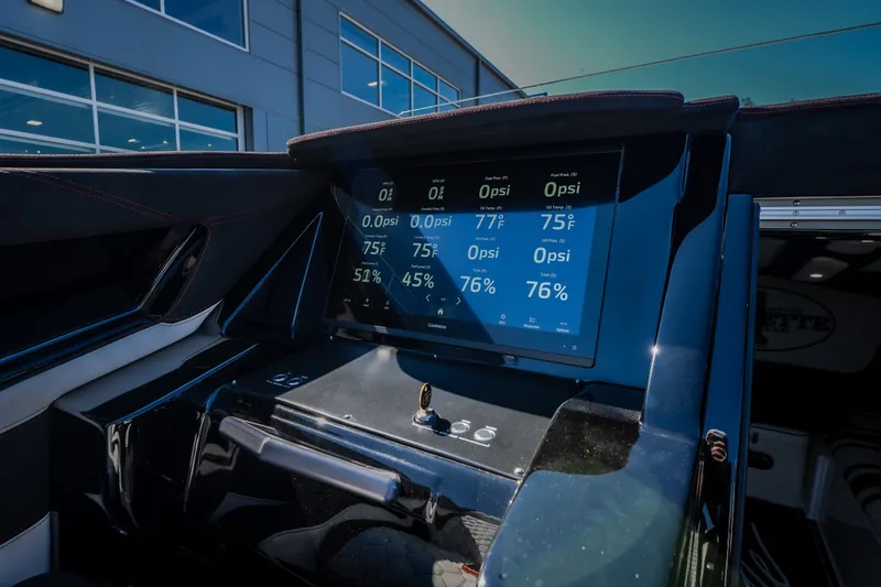 Slide: The Image of Dashboard of 2023 Cigarette 515 boat with digital display and controls. - 61